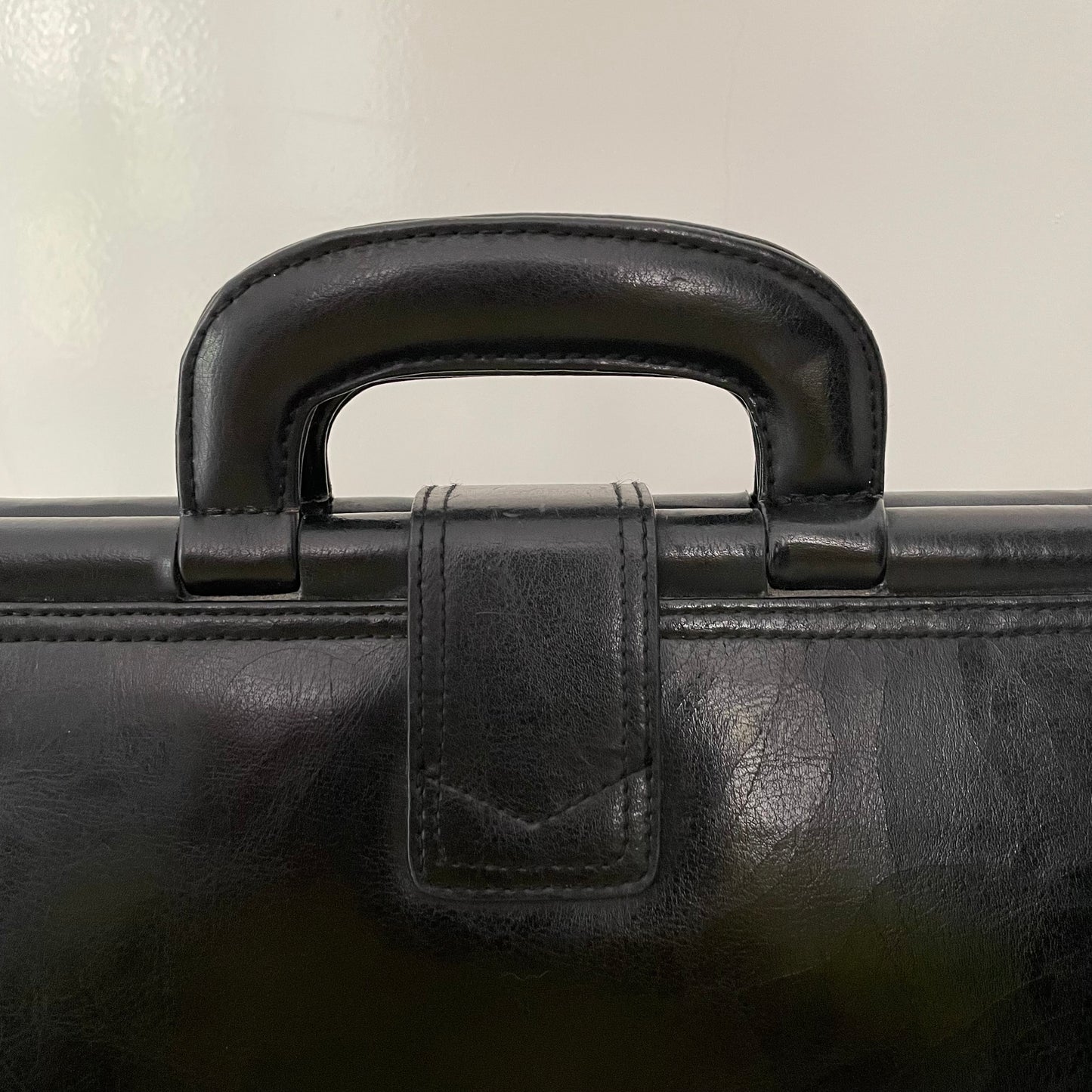 Vintage 1980s signed Lanza Black Leather bag with push lock button