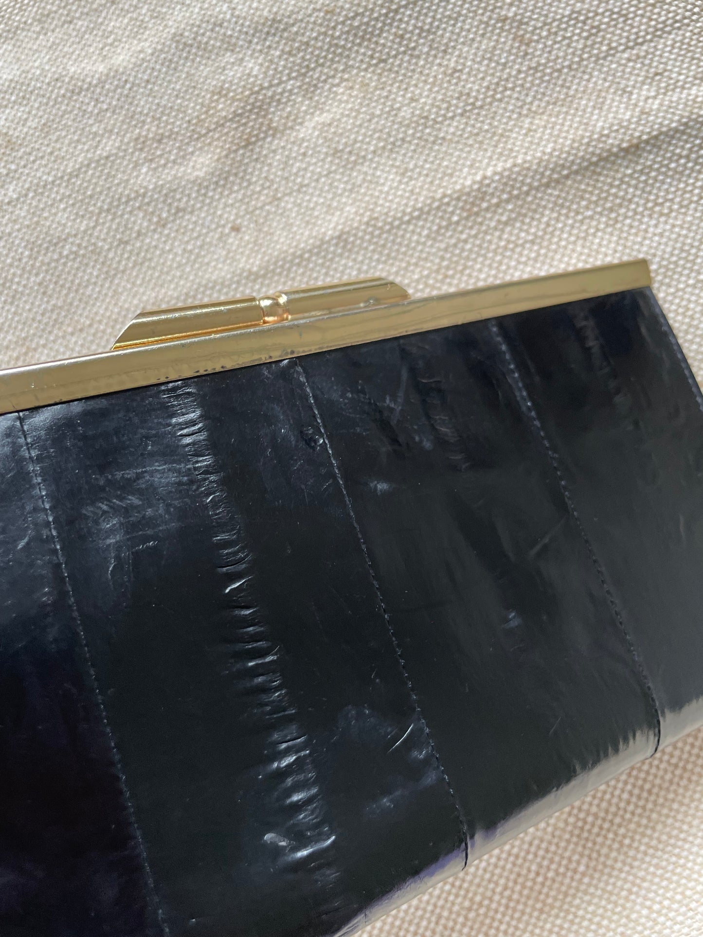 Vintage 80s Black Eel Leather Wallet with a Unique Gold Clasp