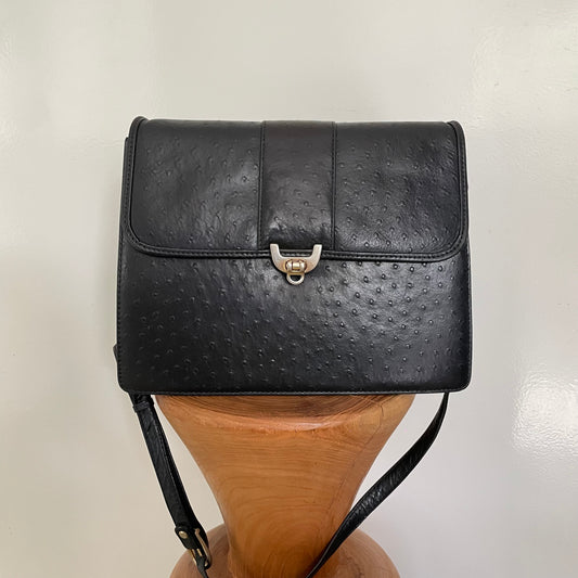 Vintage 1980s black leather bag with detailed front gold clasp