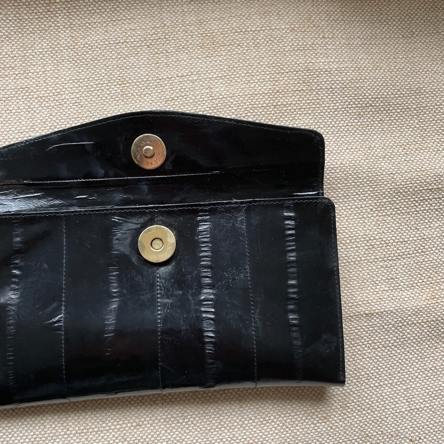 Vintage 80s Black Eel Leather Wallet with a Unique Gold Clasp