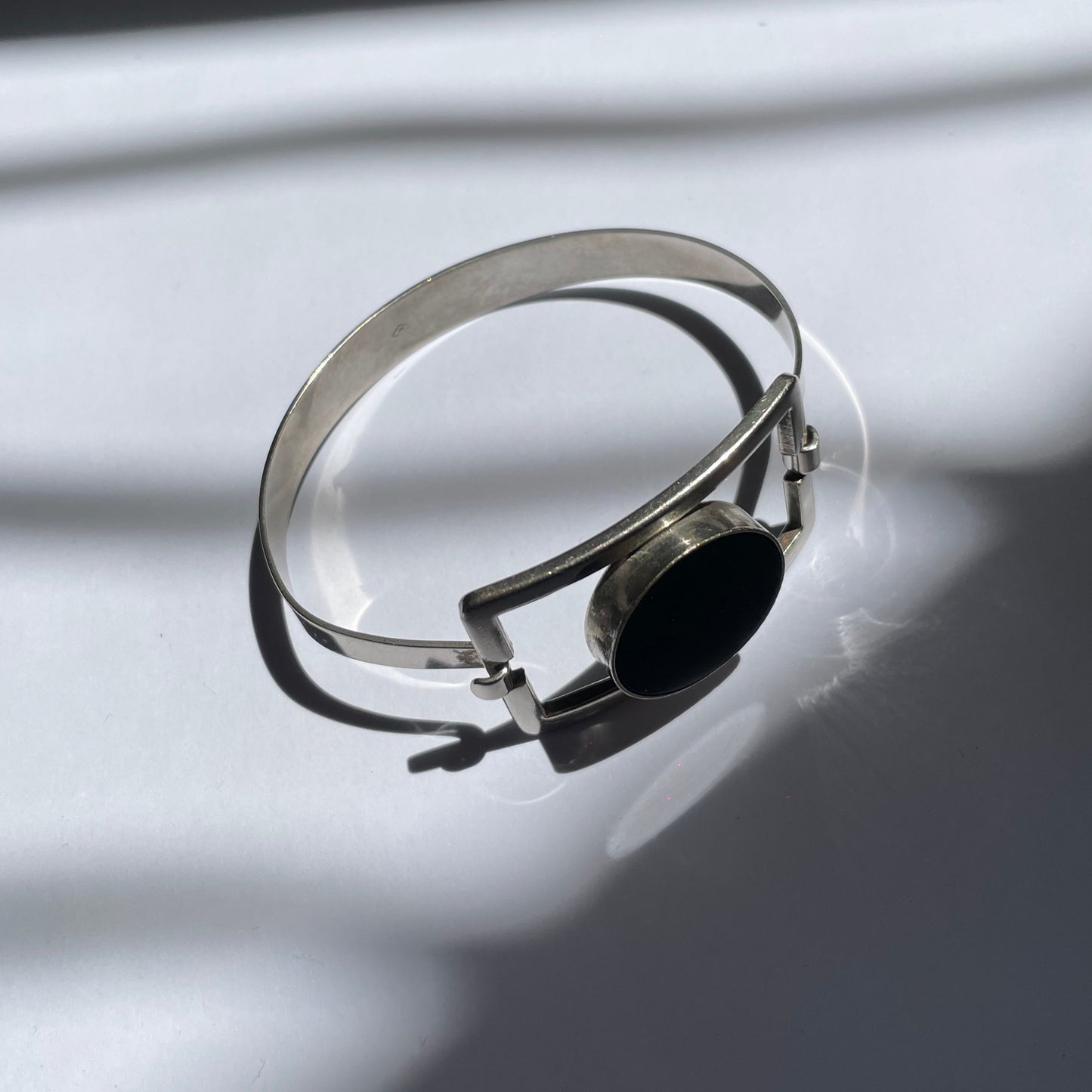 Vintage modernist 80s stainless steel bangle with black stone